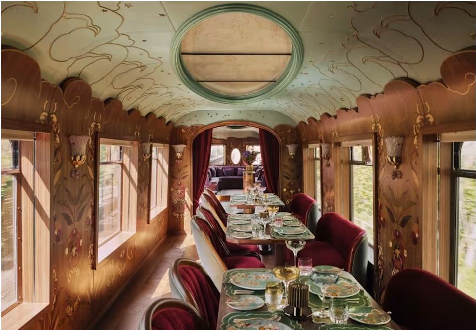 Ornate Pullman dining carriage with red seating and marquetry